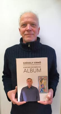 Fehérvári Zoltán festőművész a könyvvel